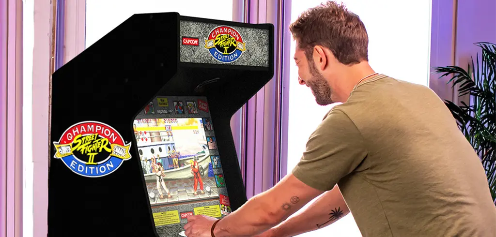 Person playing standing arcade game