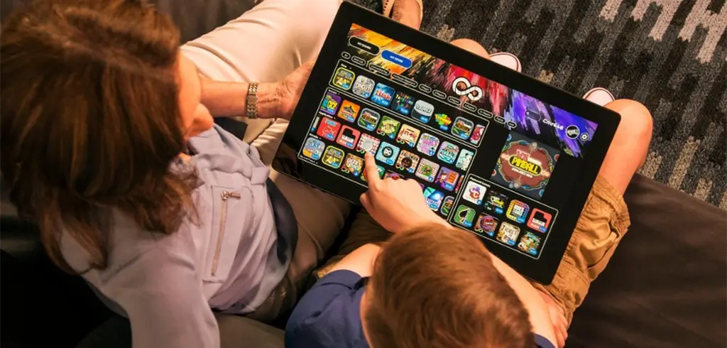 Person playing standing arcade game