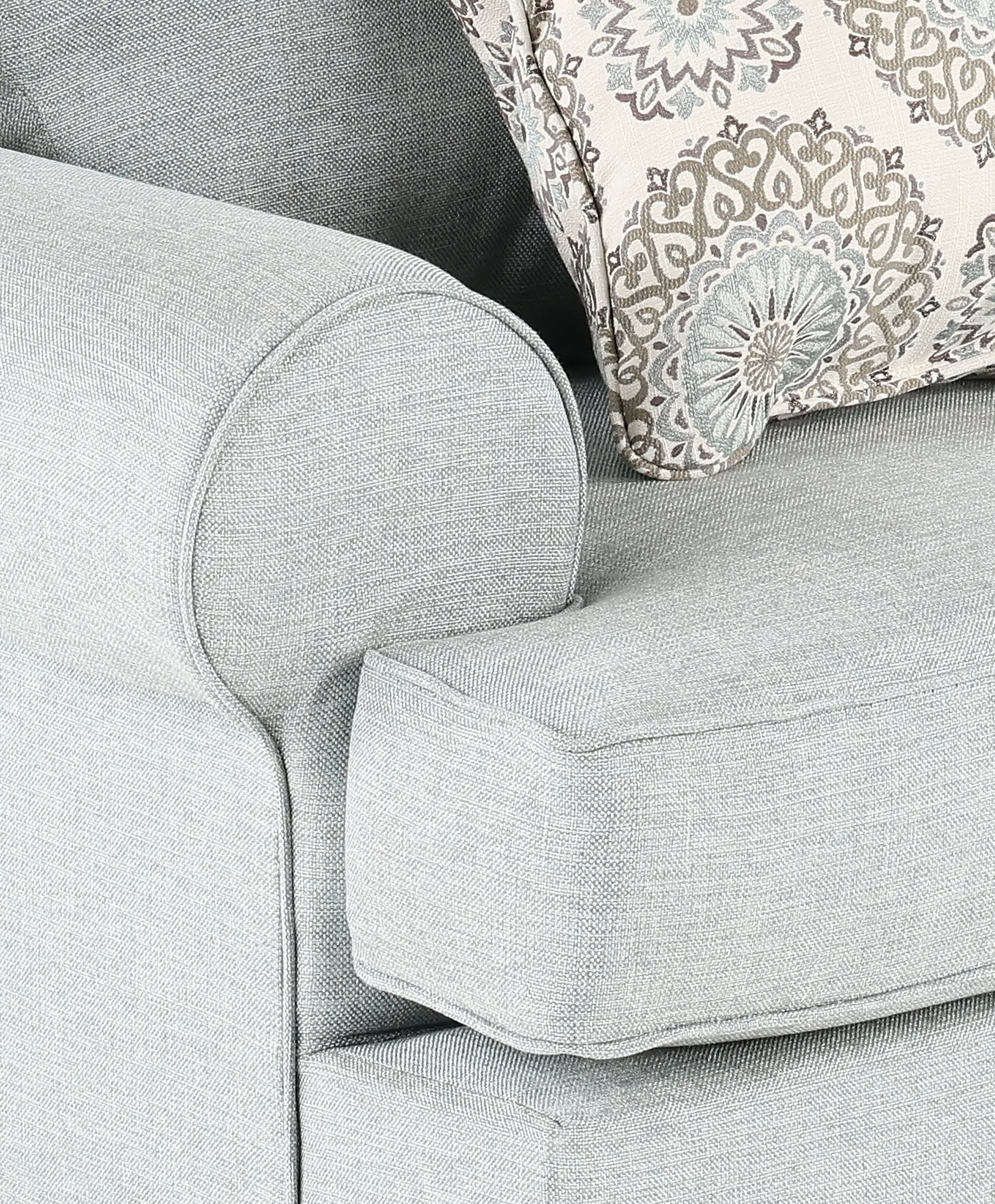 Back or three-quarter view of the same sofa with a decorative pillow