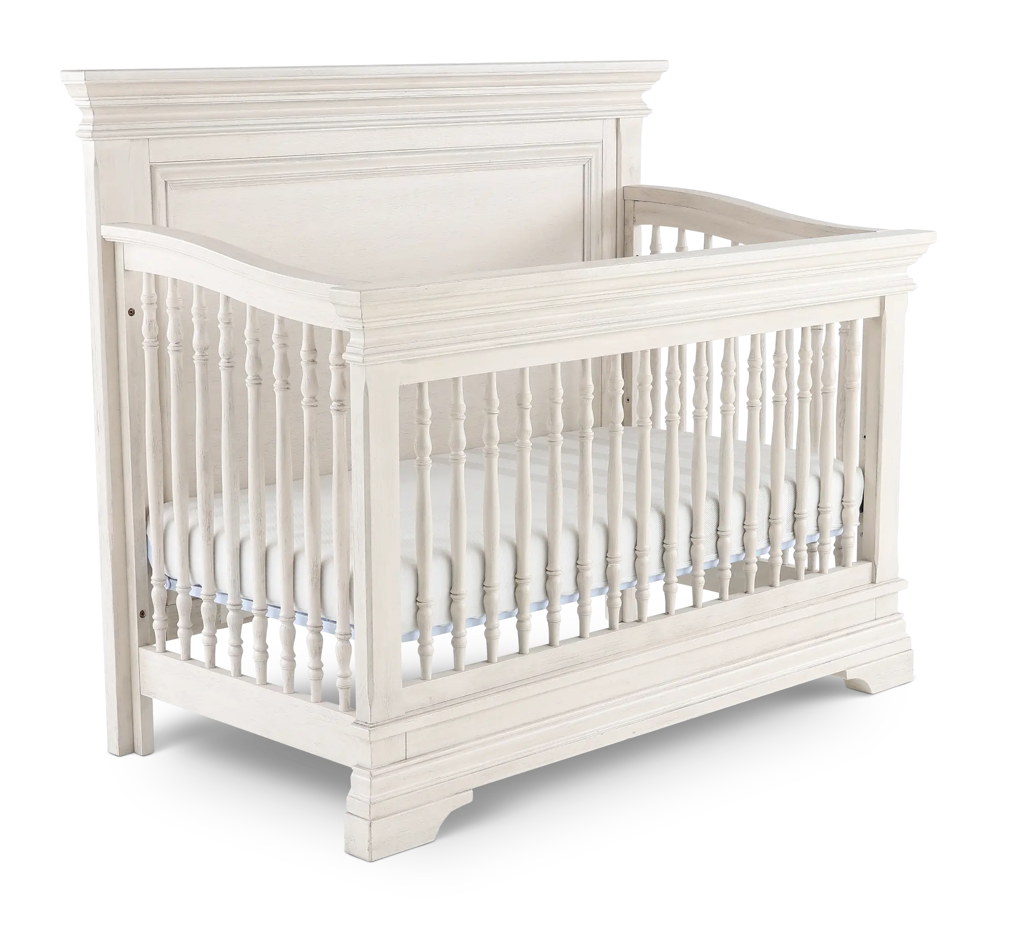 White wooden crib with tall spindles and decorative posts, corner posts and base visible