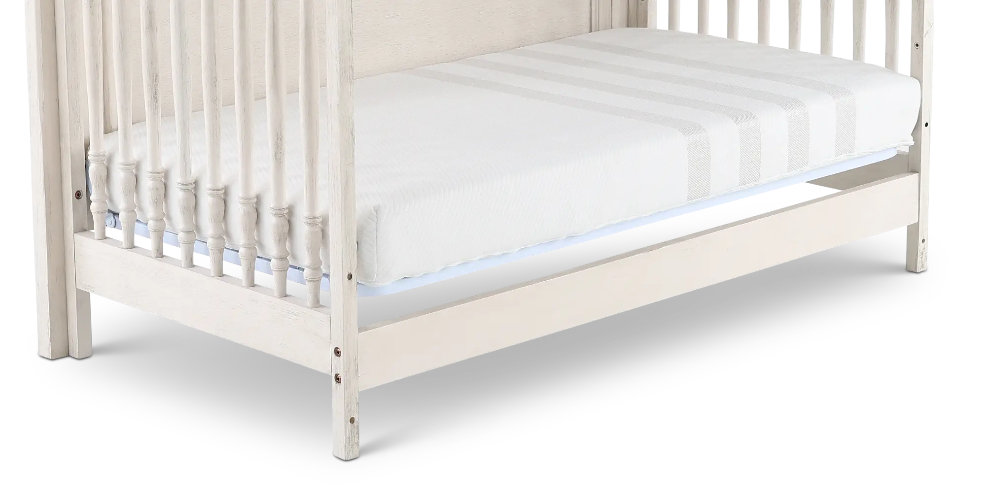White wooden crib with large back panel and inset rails