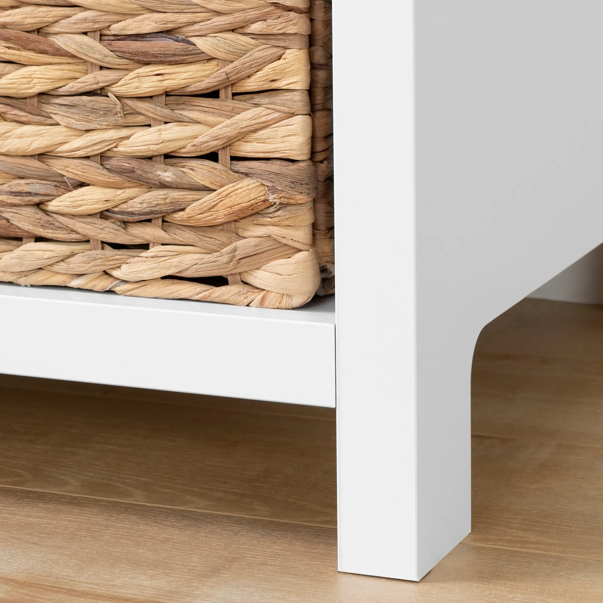 Close-up of woven basket texture inside a cubby of the dresser.
