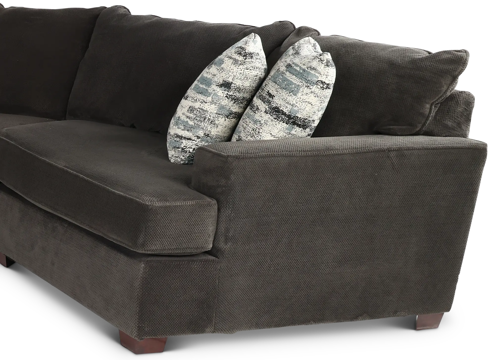 Three-seater dark grey fabric sectional sofa with coordinating patterned throw pillows.