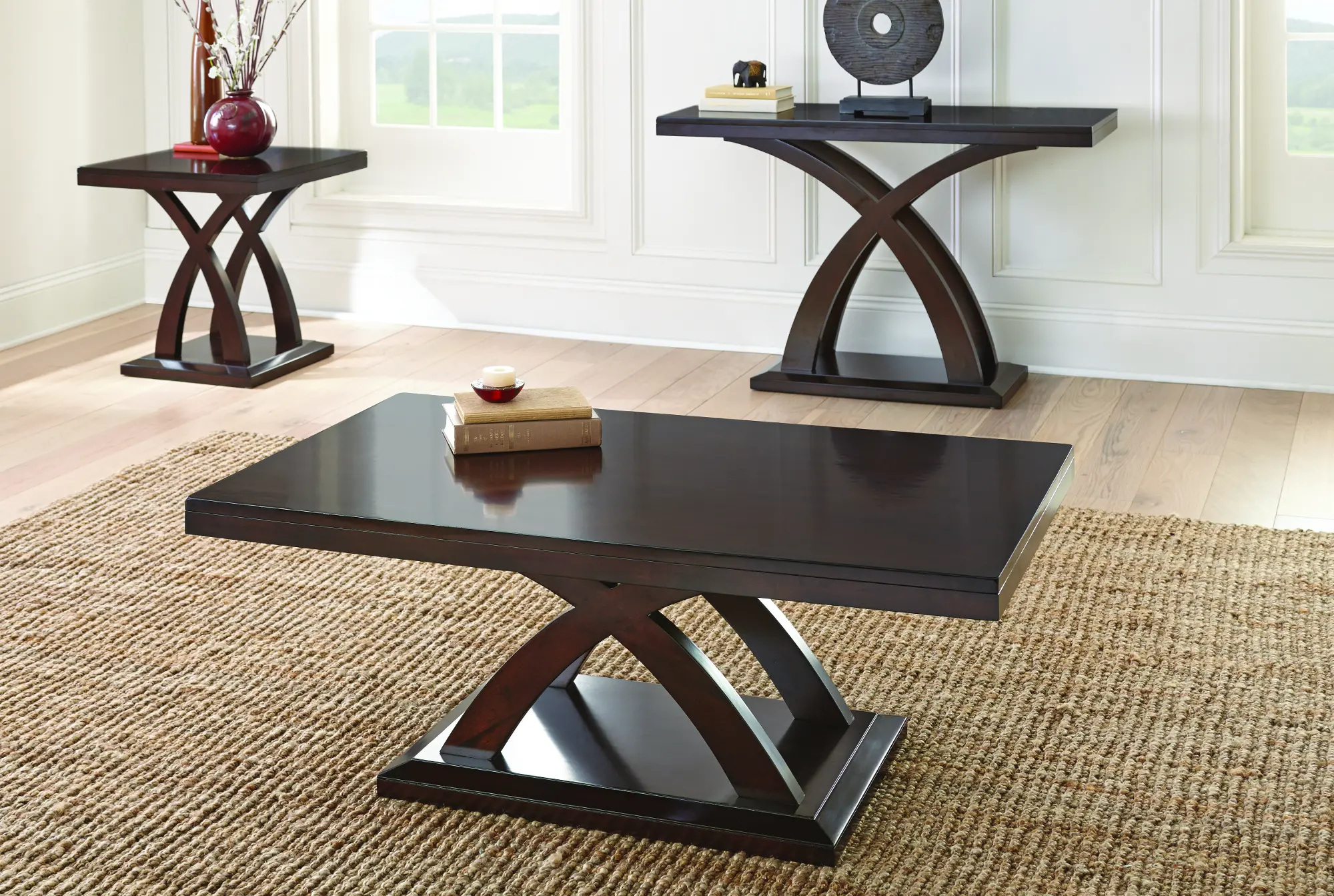 Rectangle console table with curved criss-cross leg supports and a dark finish.