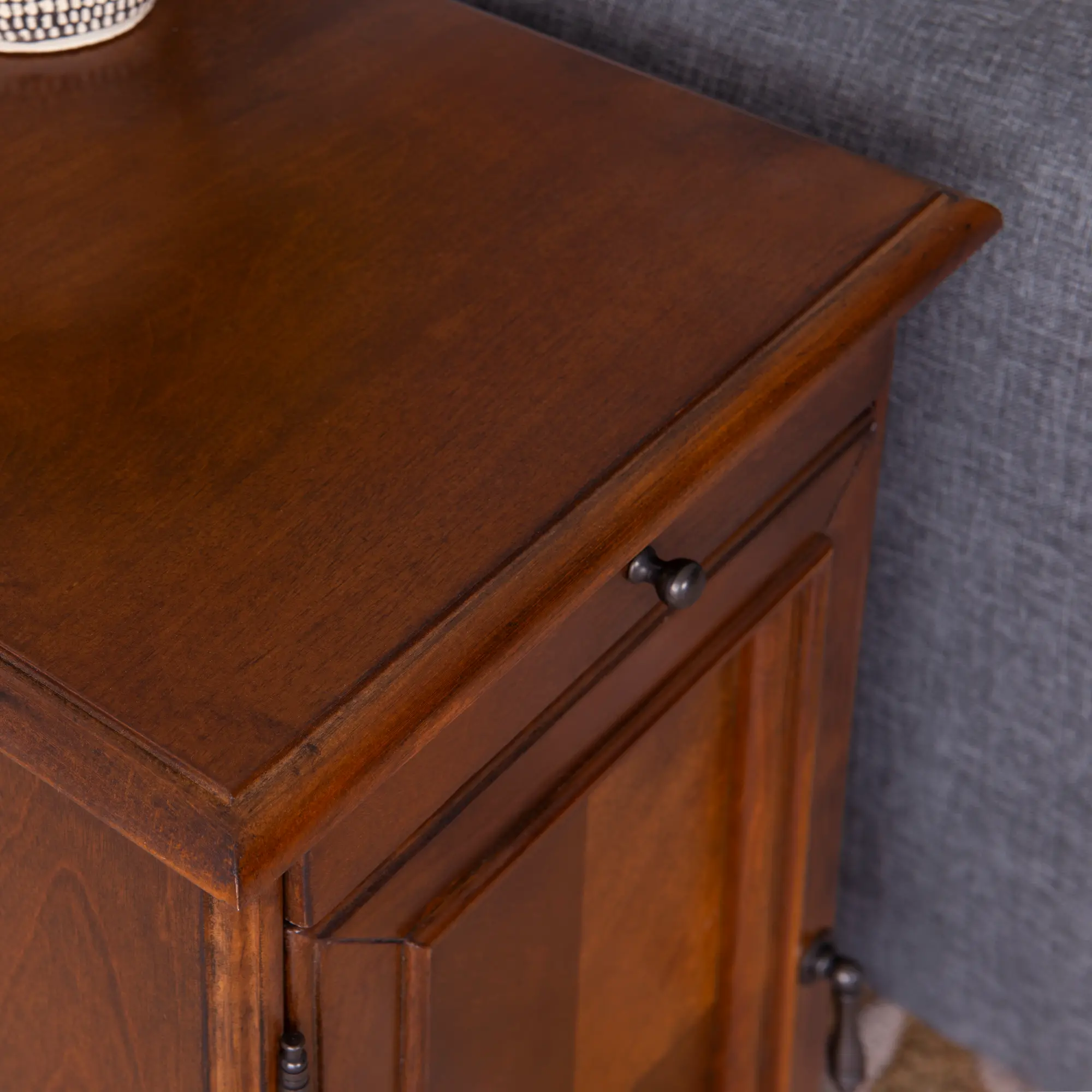 Open top panel revealing built-in outlet inside a cabinet with a slide-out tray.