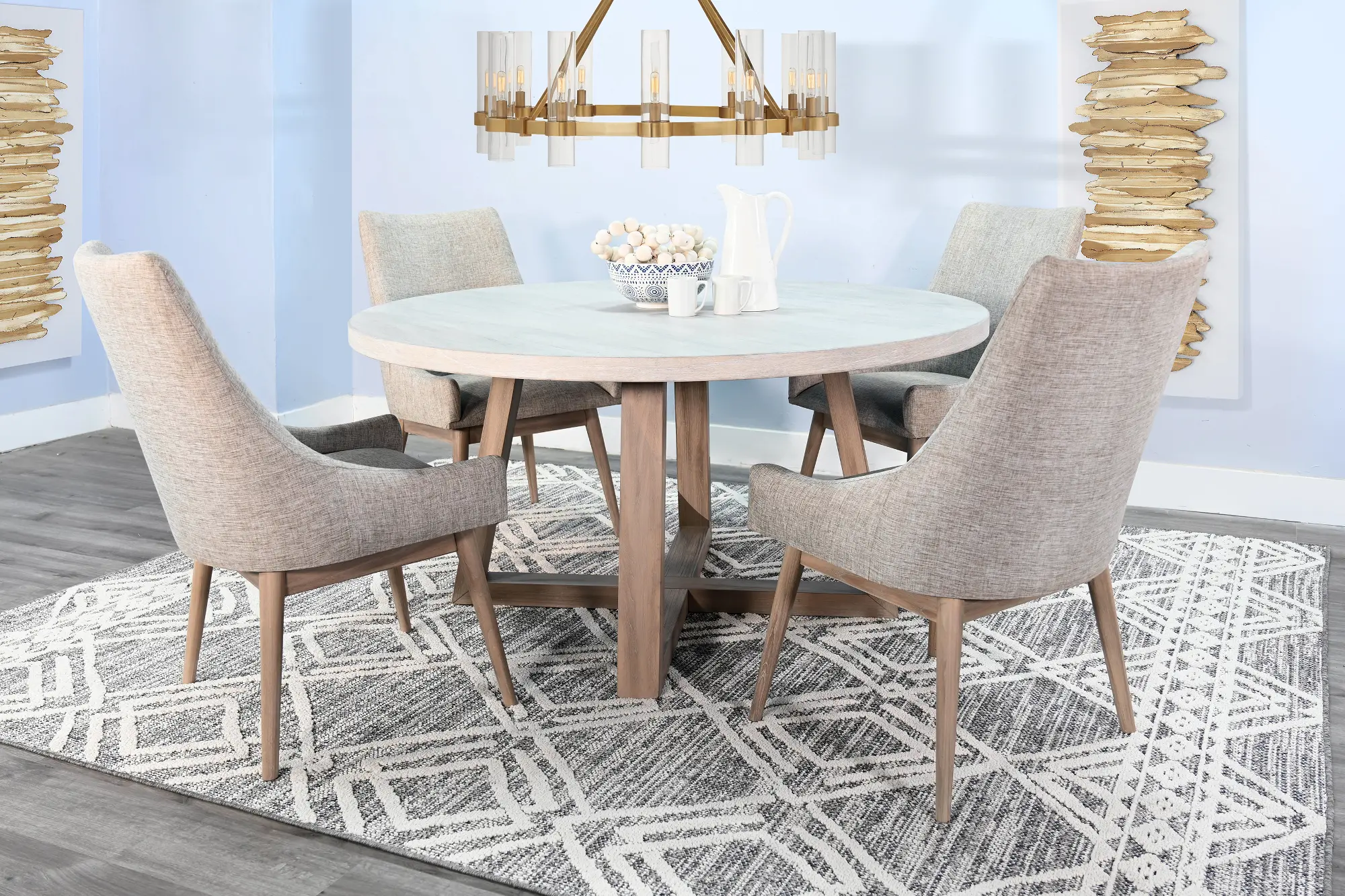 Close-up of round table top and legs with light wood finish