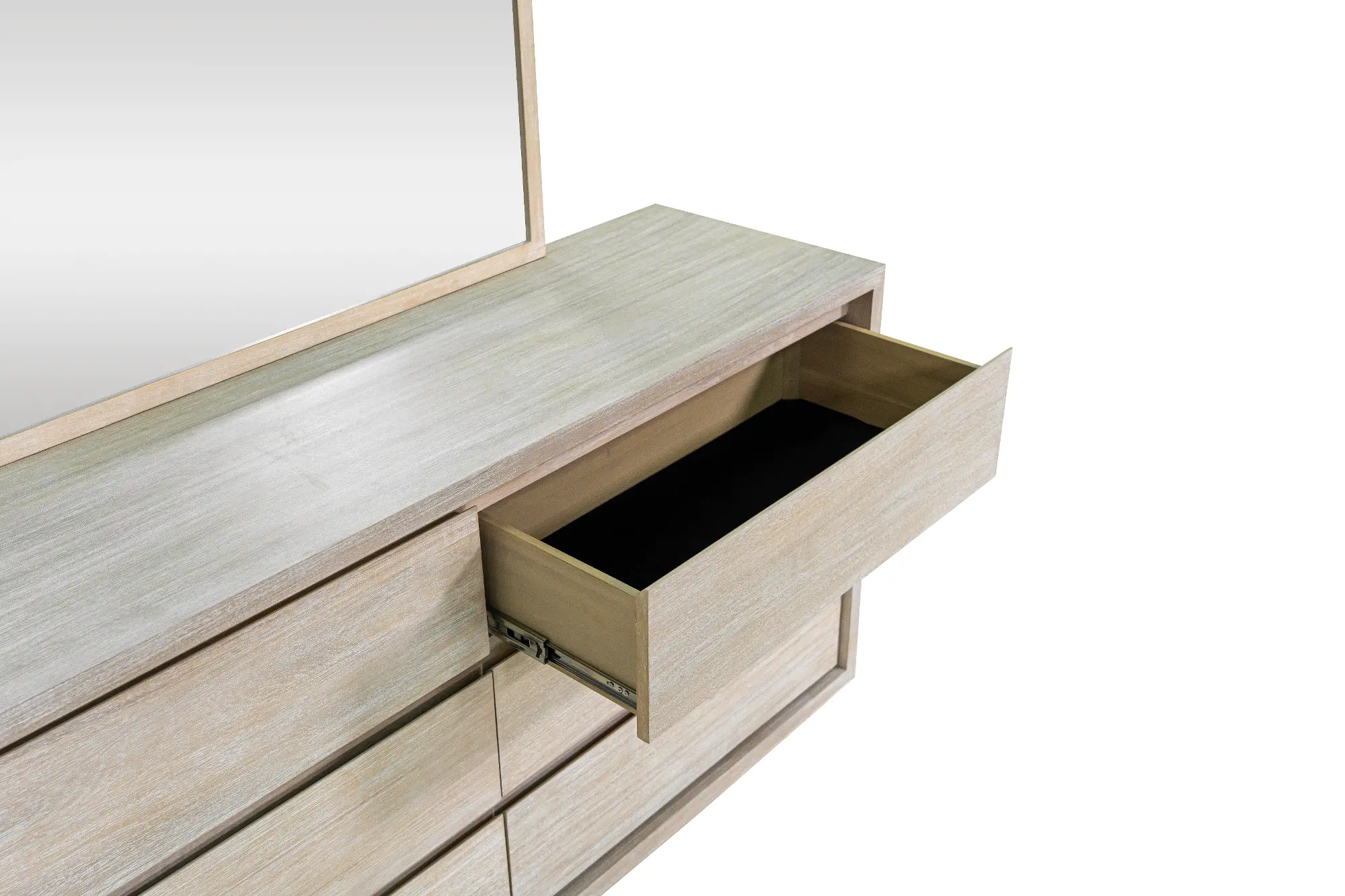 Open drawer in light wood dresser showing interior storage with metal drawer slides.
