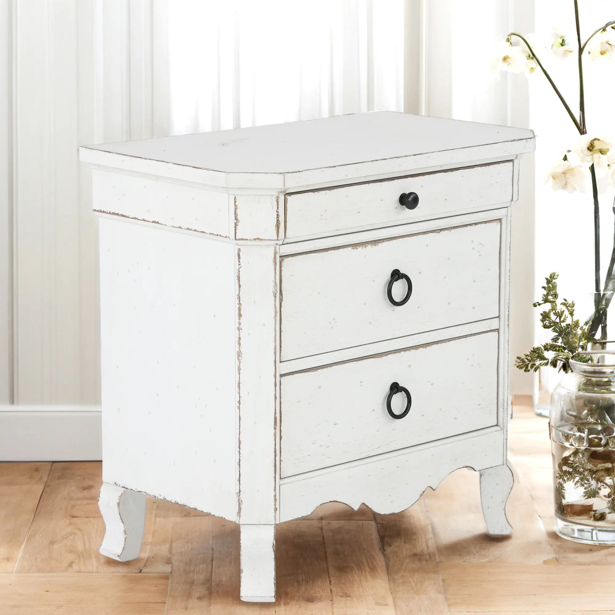 Close-up of drawer handles and edge of nightstand