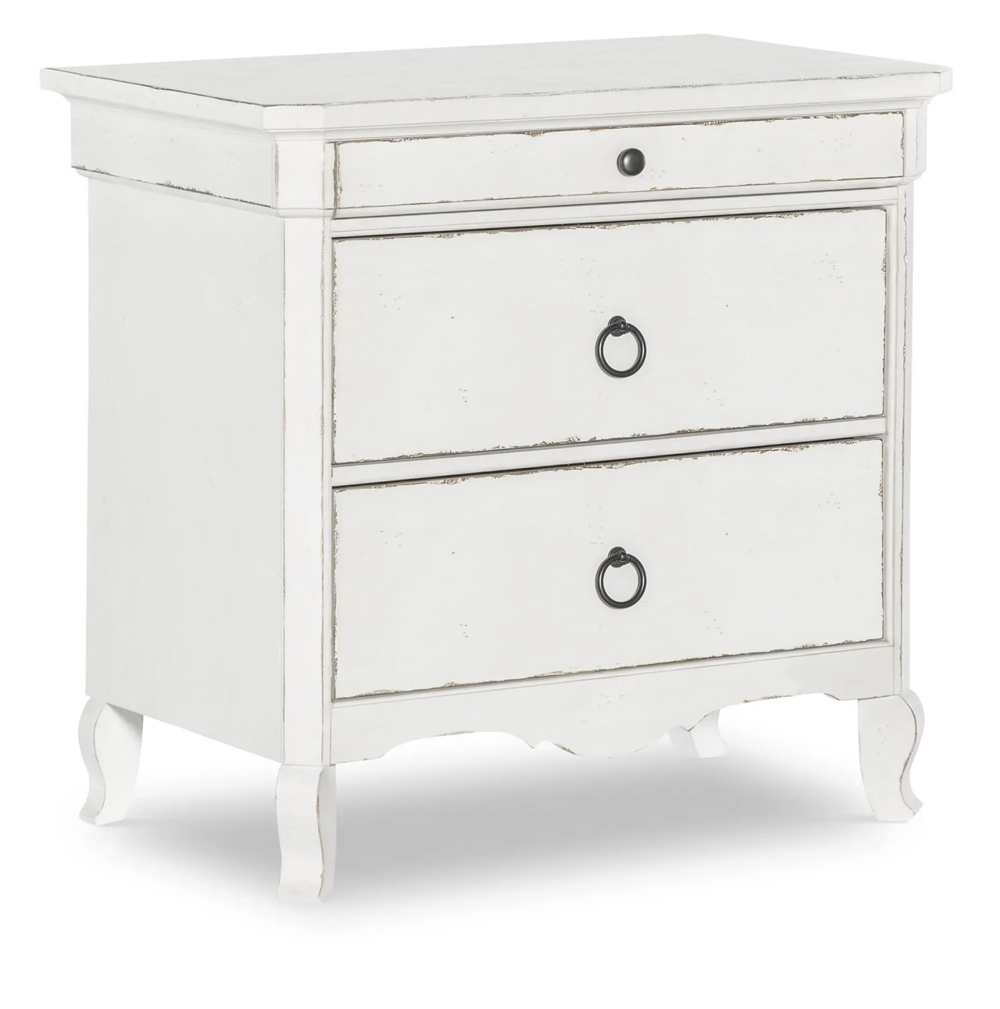 Close-up front view of a distressed white nightstand with three drawers and ornate bottom edge.