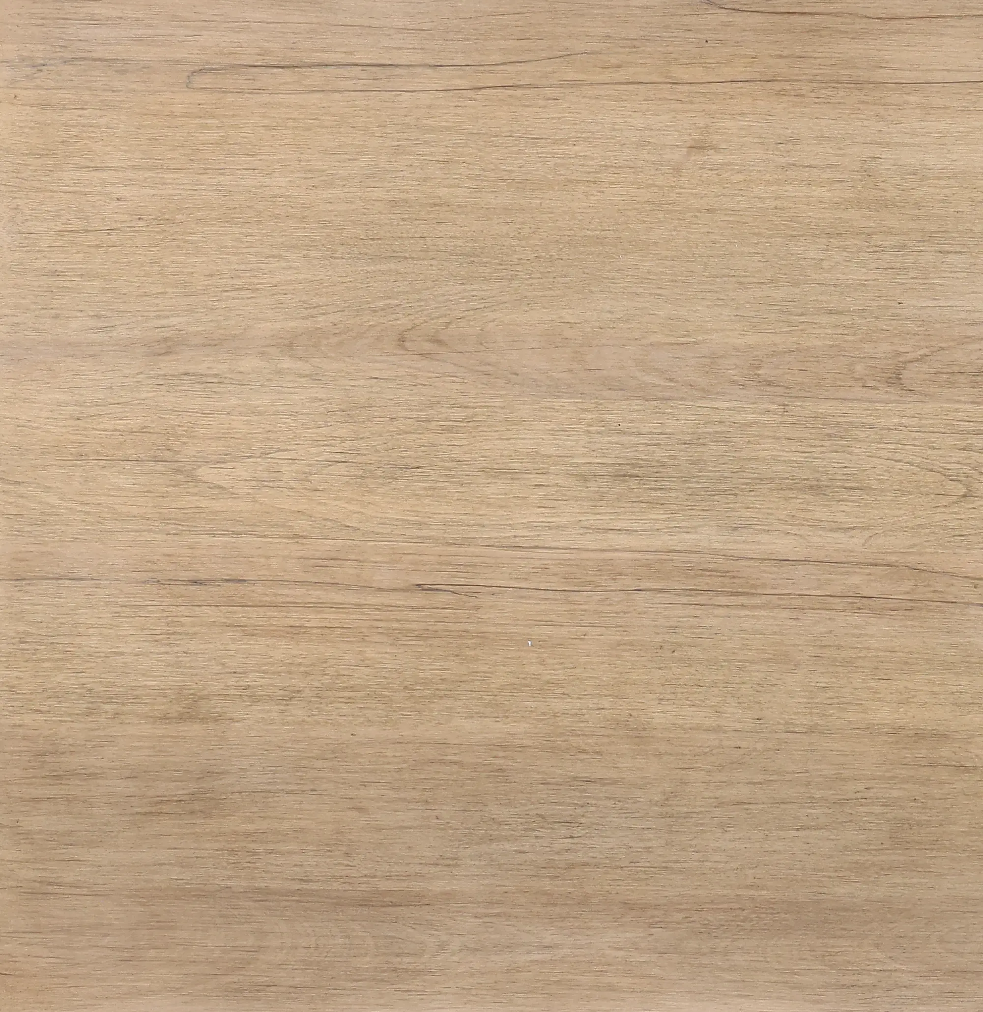 Close-up view of light wood tabletop showing wood grain, likely a furniture piece.