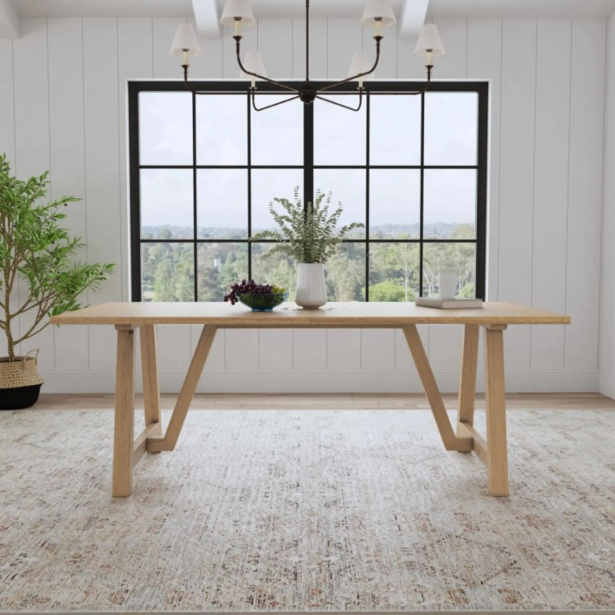 Front view of a wooden dining table with angled trestle legs and a rectangular top.