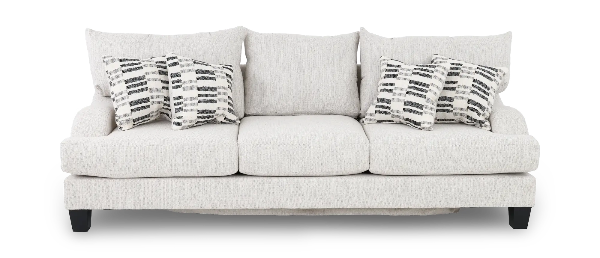 Three-seat light beige sofa with black-and-white patterned throw pillows in a living room
